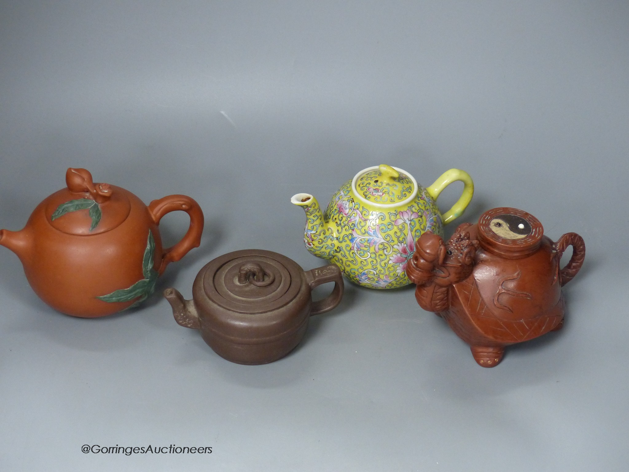 Three Chinese Yixing teapots and a yellow ground teapot, height 10cm